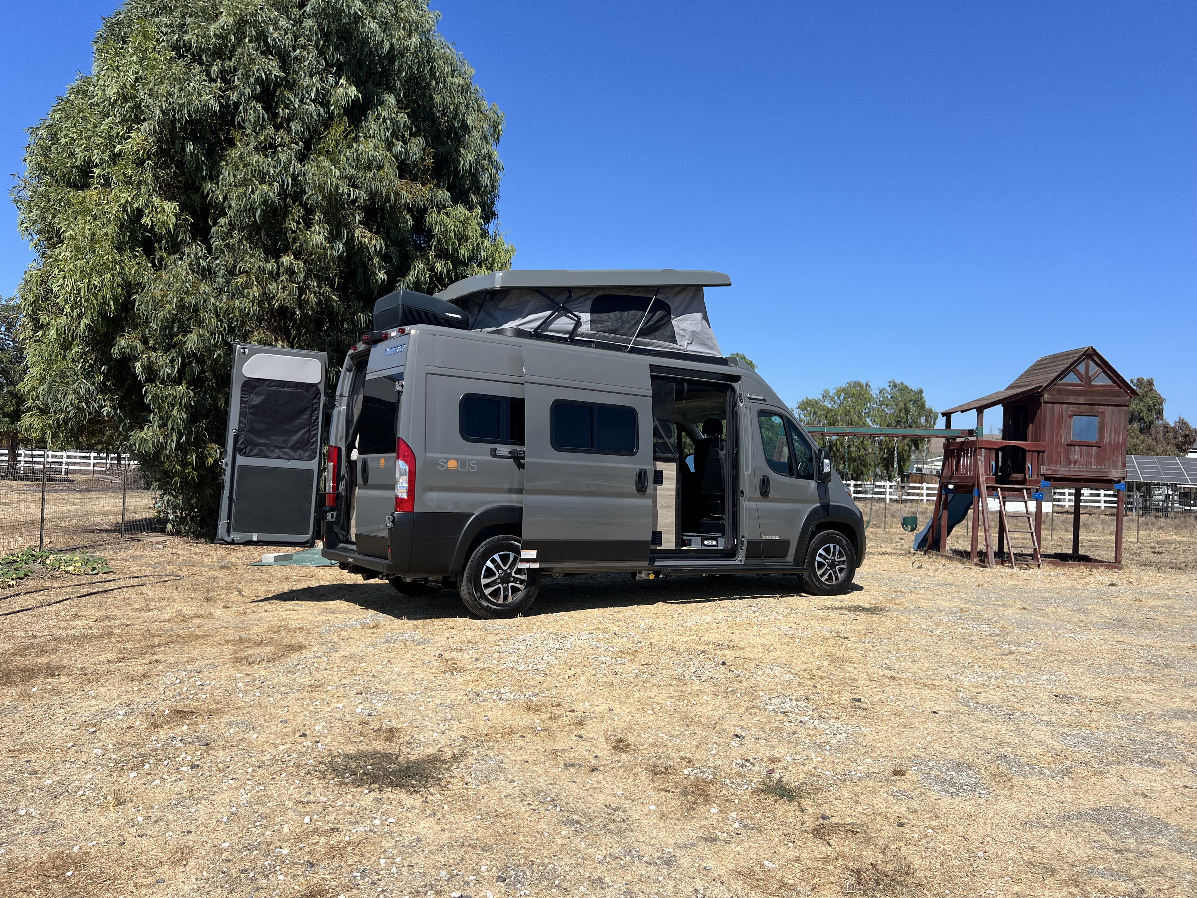 Nomadaya camper van parked at sunrise near the mountains